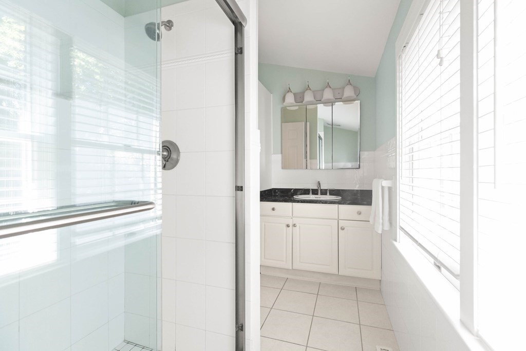 220 Perkins Row Topsfield, MA 01983 - Photo 23 of 42 a bathroom with a sink vanity and a mirror