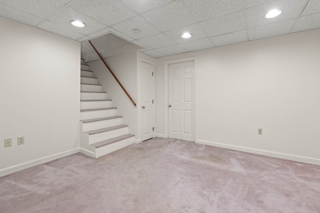 220 Perkins Row Topsfield, MA 01983 - Photo 27 of 42 an empty room with a stairs