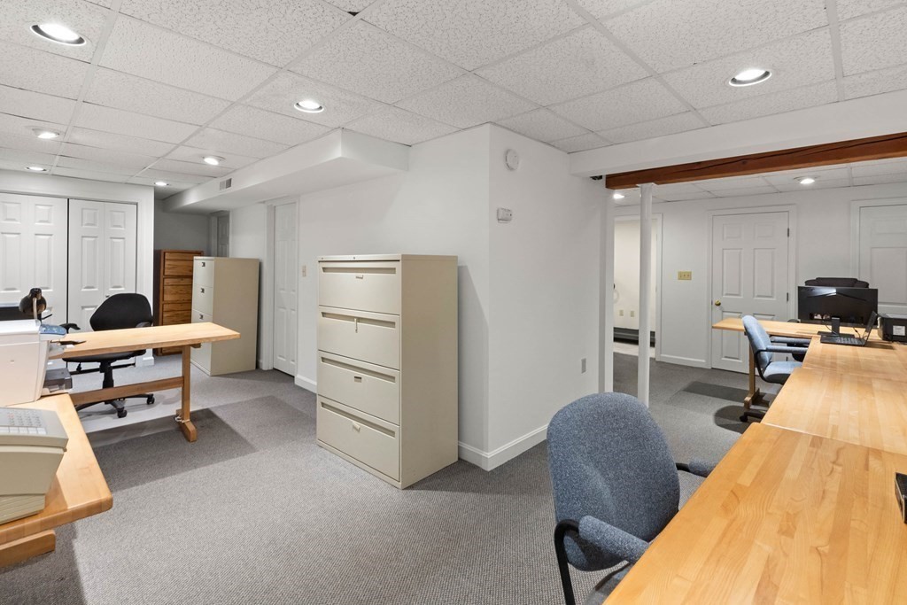 220 Perkins Row Topsfield, MA 01983 - Photo 30 of 42 a living room with furniture and a computer on a table
