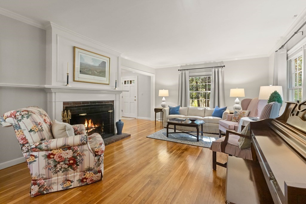 220 Perkins Row Topsfield, MA 01983 - Photo 5 of 42 a living room with furniture and a fireplace