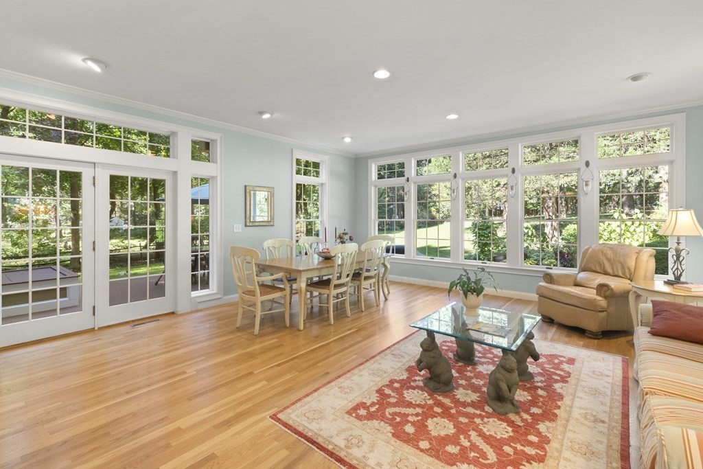 220 Perkins Row Topsfield, MA 01983 - Photo 10 of 42 a living room with furniture and a large window