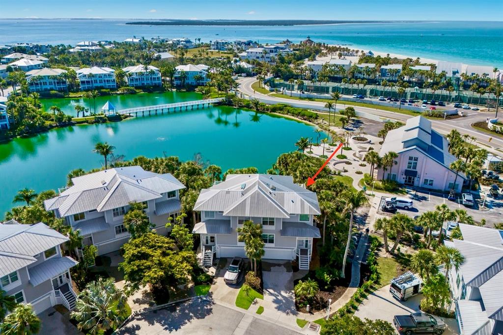 799 Beach View Drive Boca Grande, FL 33921 - Photo 1 of 77 an aerial view of a house with a lake view and a mountain view
