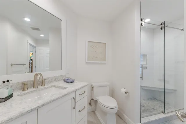 a bedroom with two beds and a large window