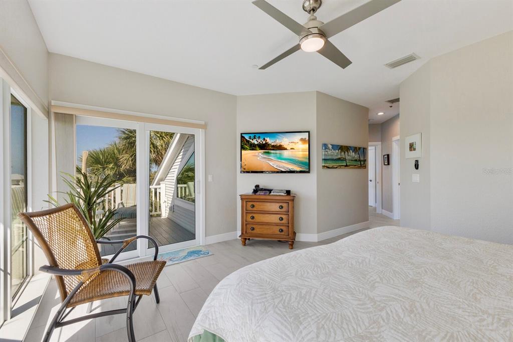 799 Beach View Drive Boca Grande, FL 33921 - Photo 19 of 77 a bedroom with furniture and a window
