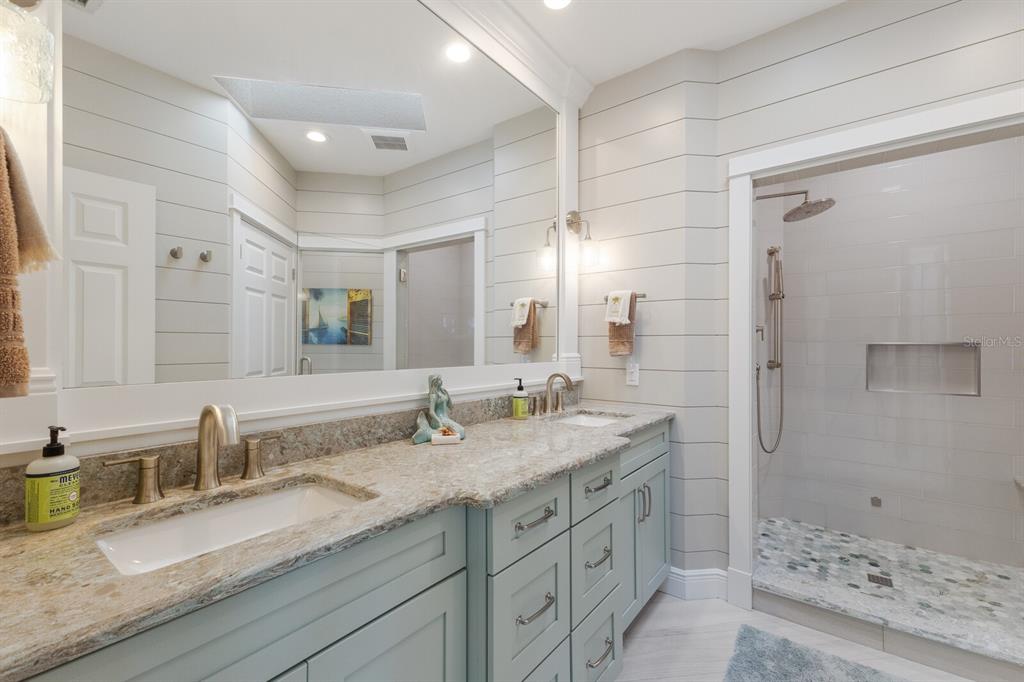 799 Beach View Drive Boca Grande, FL 33921 - Photo 20 of 77 a bathroom with double sink and a mirror