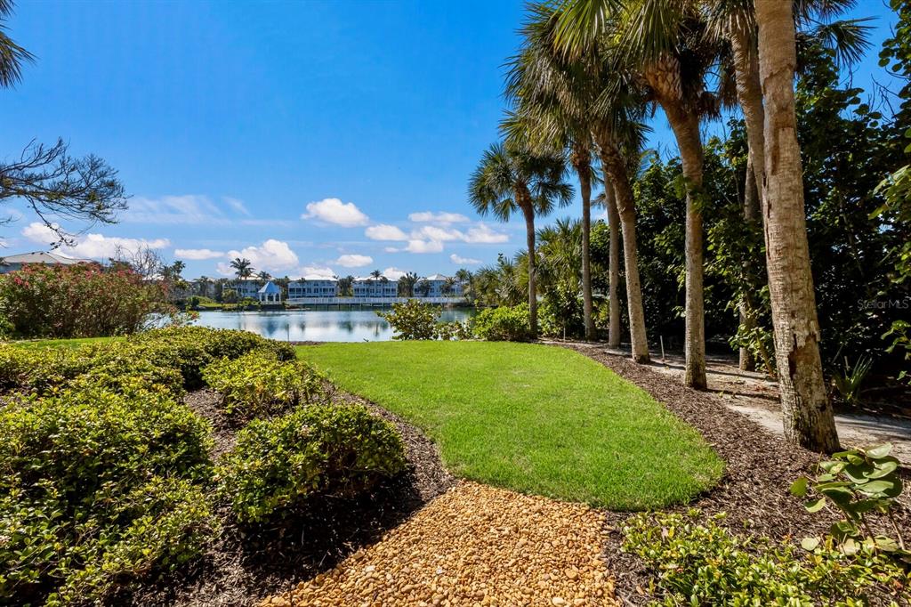 799 Beach View Drive Boca Grande, FL 33921 - Photo 28 of 77 a view of a garden with a building in the background
