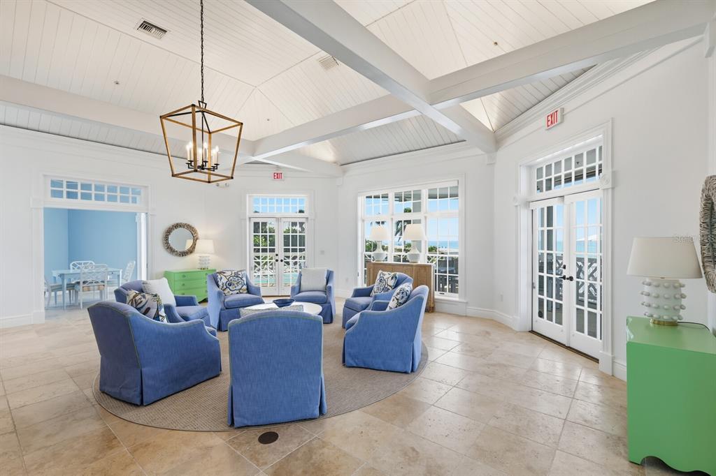 799 Beach View Drive Boca Grande, FL 33921 - Photo 36 of 77 a living room with couches a dining table and chairs with wooden floor