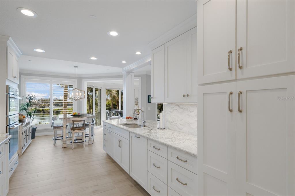 799 Beach View Drive Boca Grande, FL 33921 - Photo 9 of 77 a large white kitchen with a large window