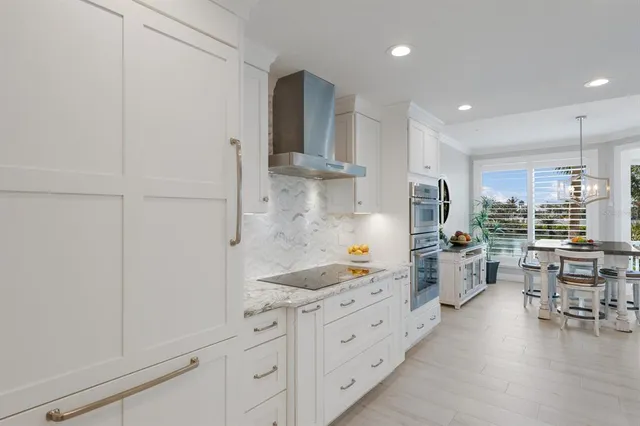 a bedroom with a bed and a tv on the dresser