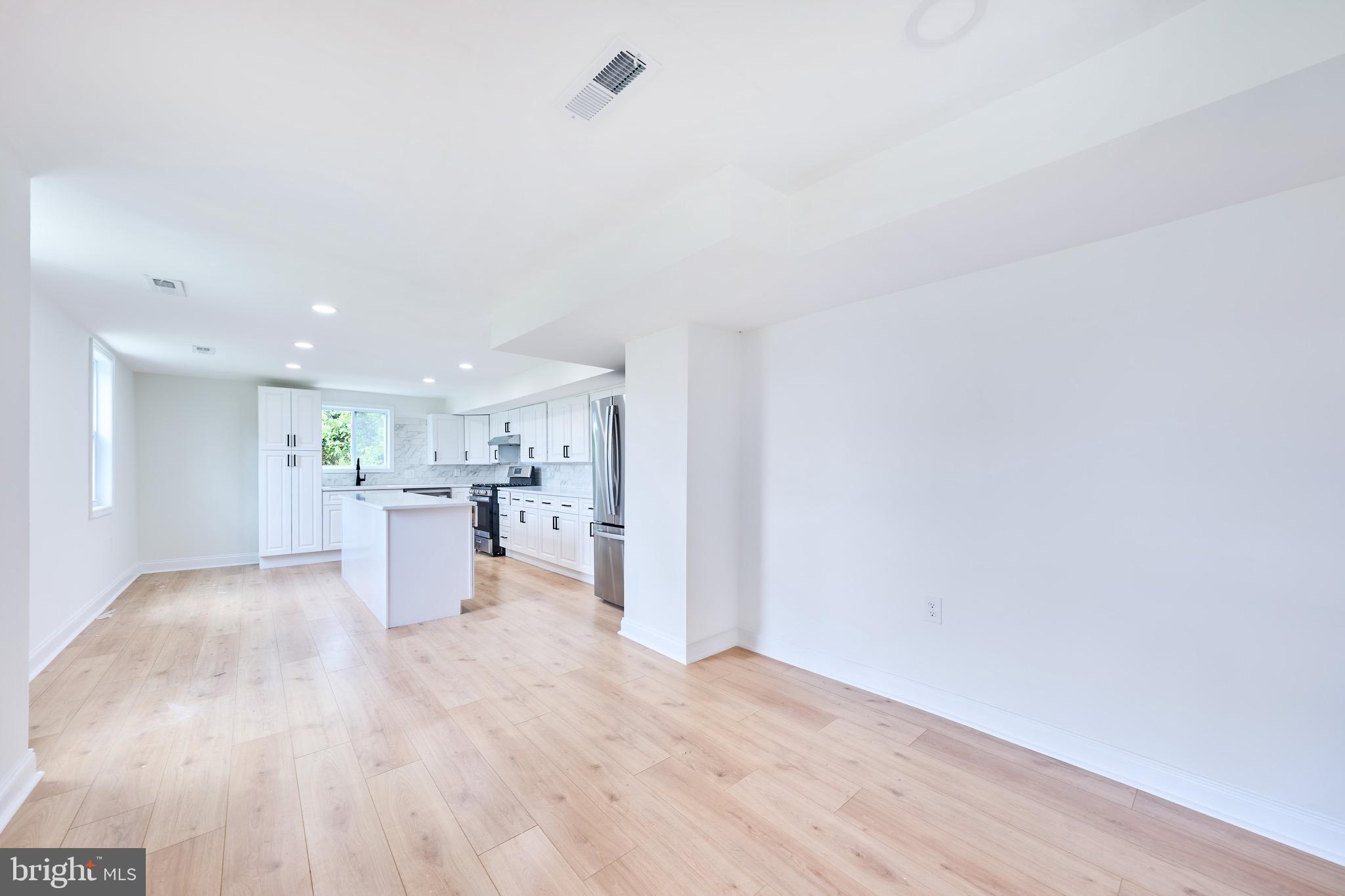 3511 Old Frederick Road Baltimore, MD 21229 - Photo 14 of 43 a view of a living room and kitchen with furniture