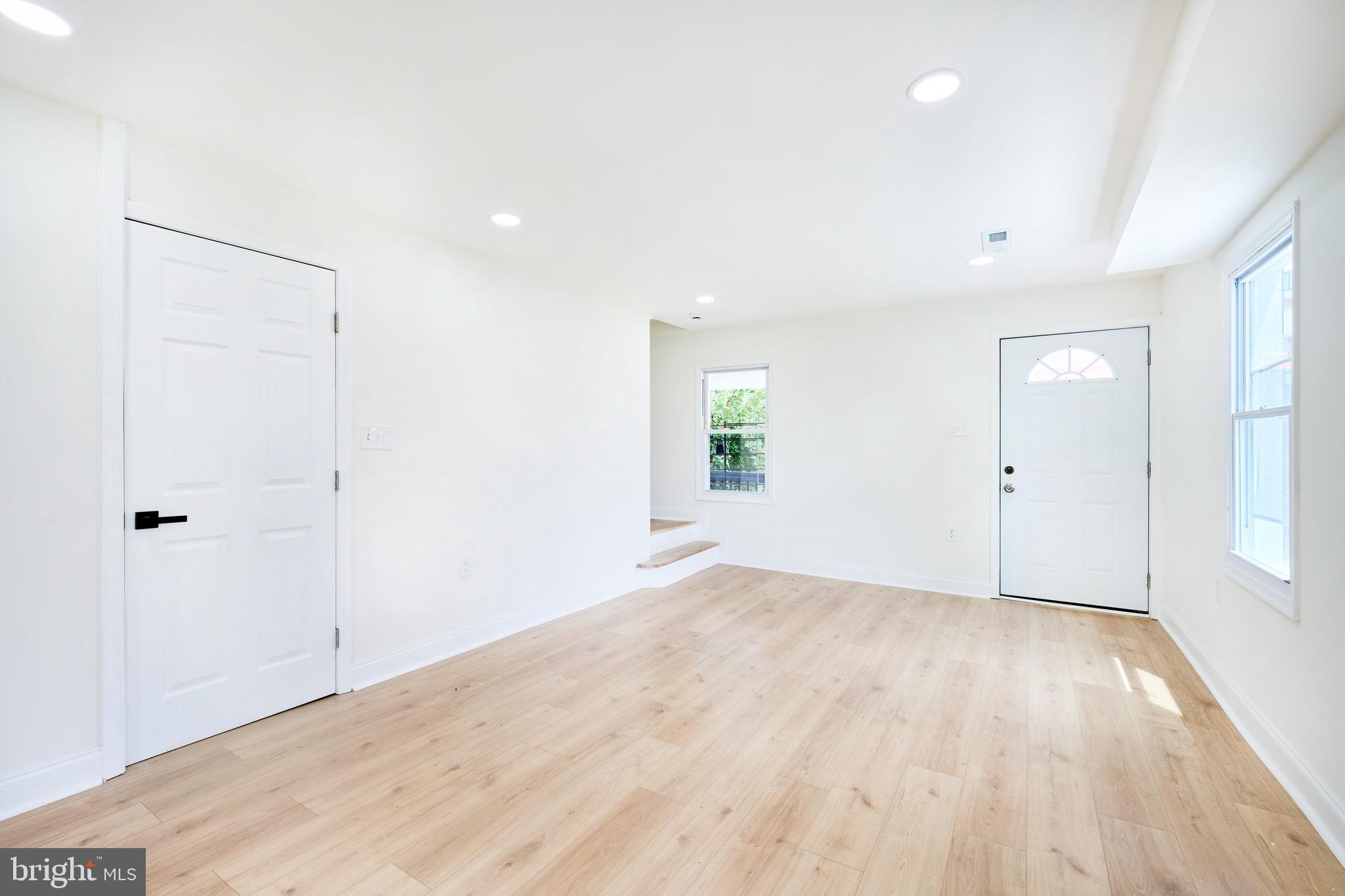 3511 Old Frederick Road Baltimore, MD 21229 - Photo 19 of 43 wooden floor in an empty room with a window