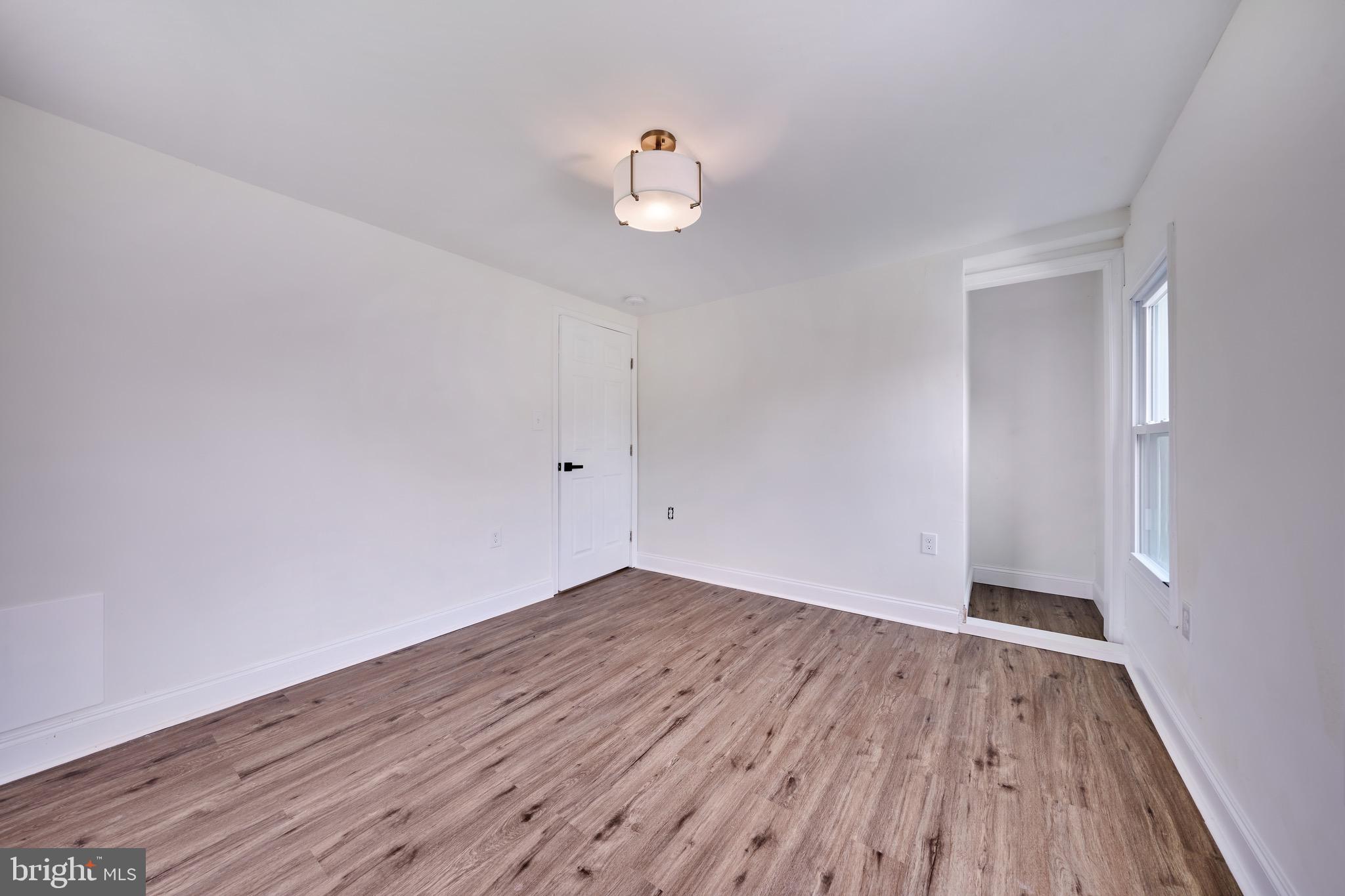 3511 Old Frederick Road Baltimore, MD 21229 - Photo 39 of 43 a view of empty room with wooden floor