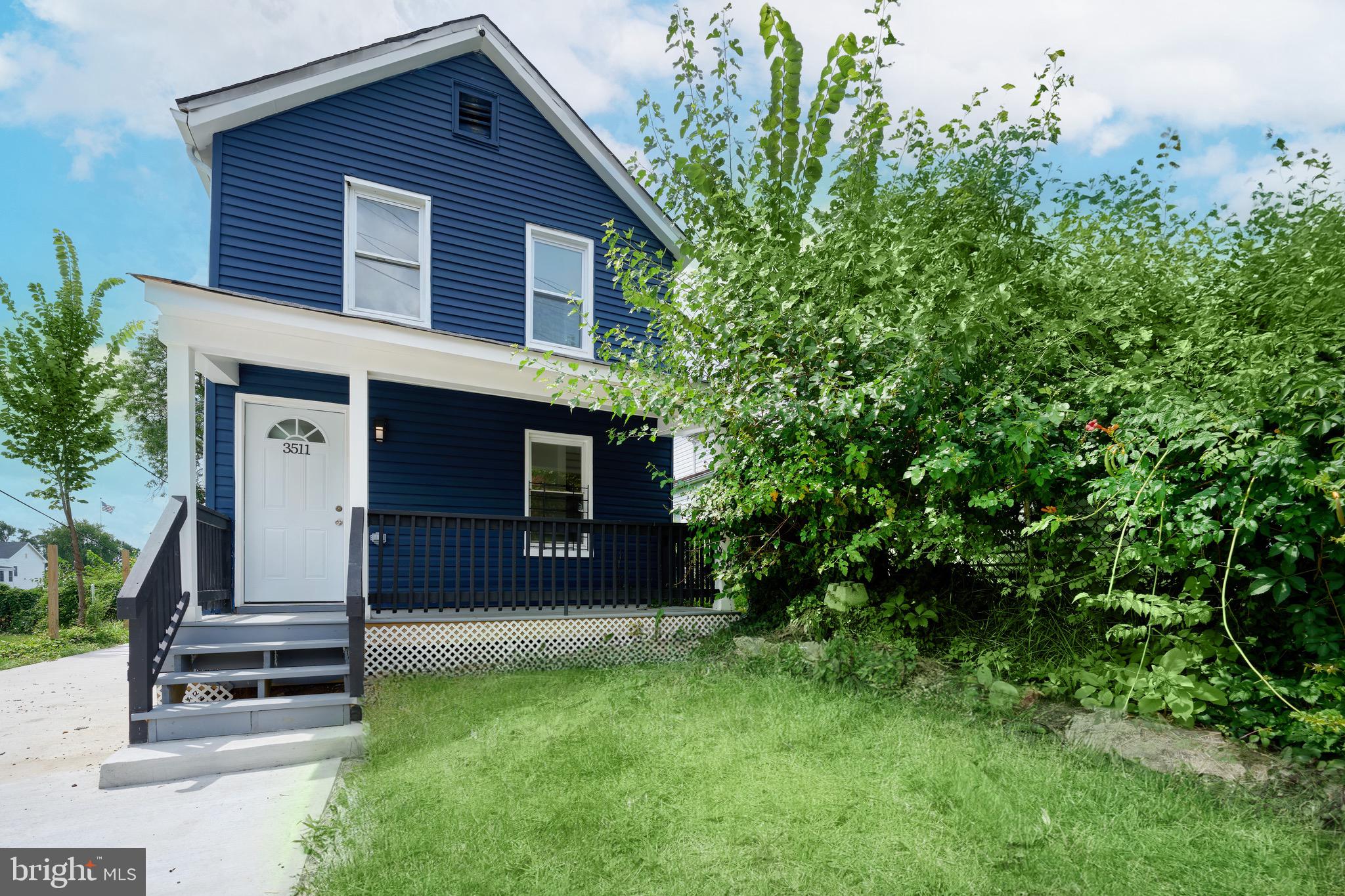 3511 Old Frederick Road Baltimore, MD 21229 - Photo 5 of 43 front view of a house with a yard