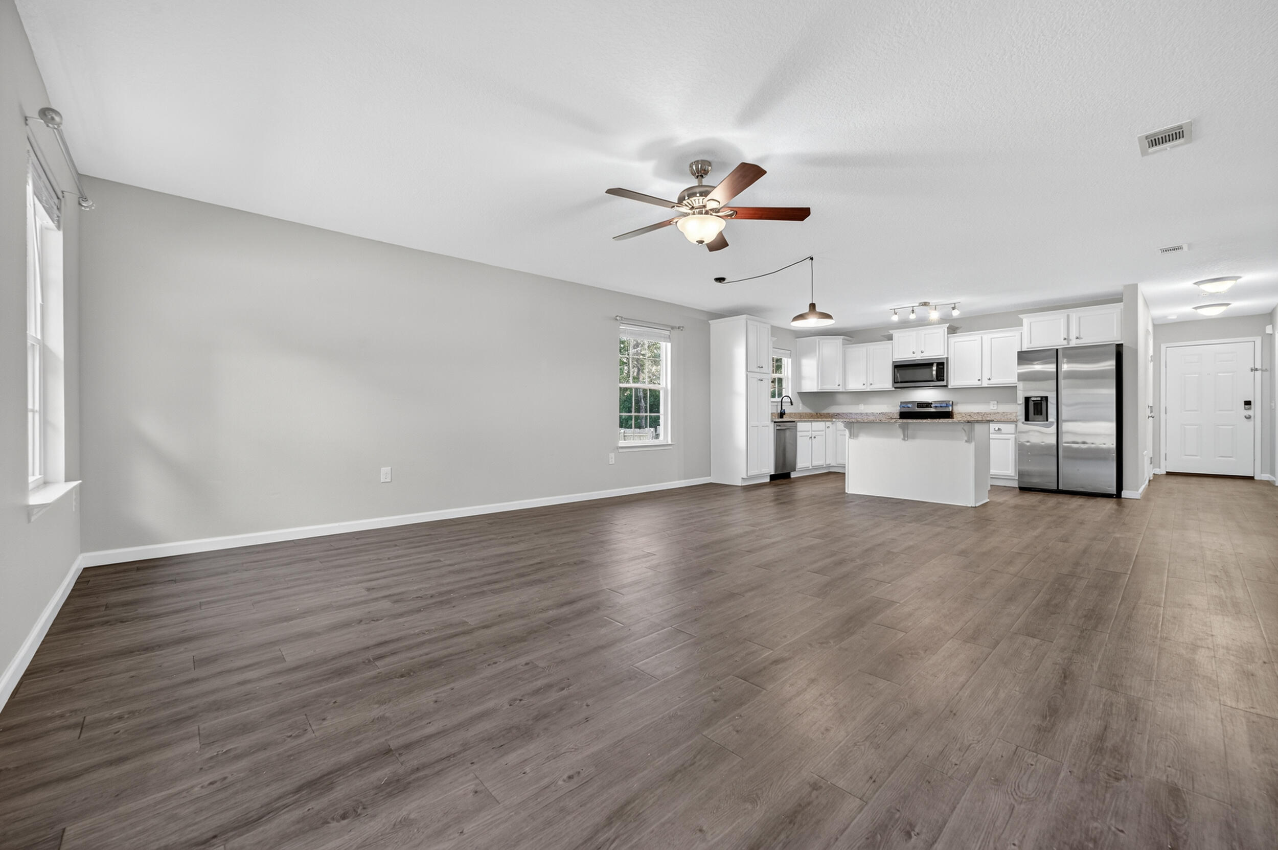 1833 Gainer Avenue Baker, FL 32531 - Photo 13 of 43 a view of a kitchen with a stove cabinets and wooden floor