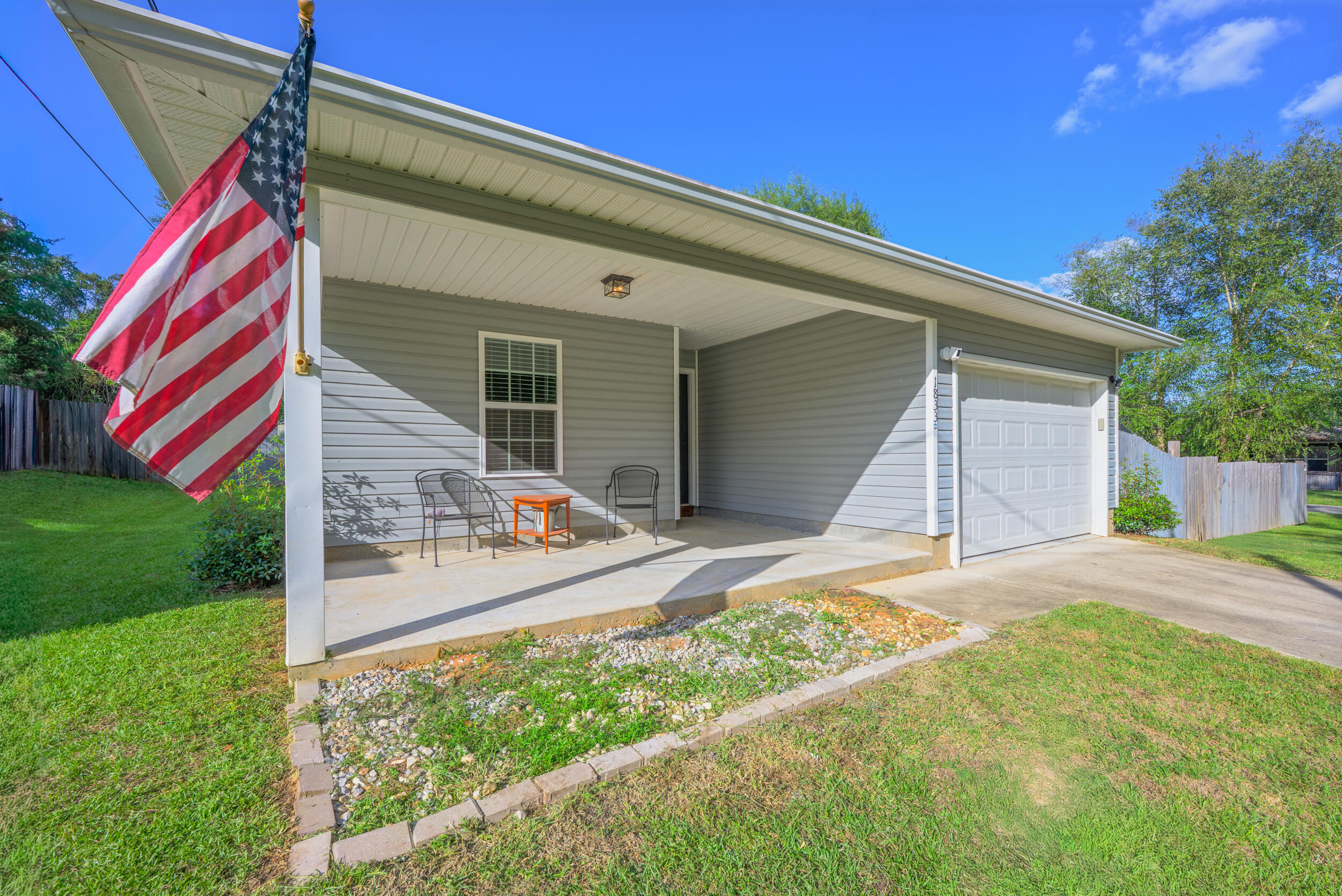 1833 Gainer Avenue Baker, FL 32531 - Photo 2 of 43 a front view of a house with garden