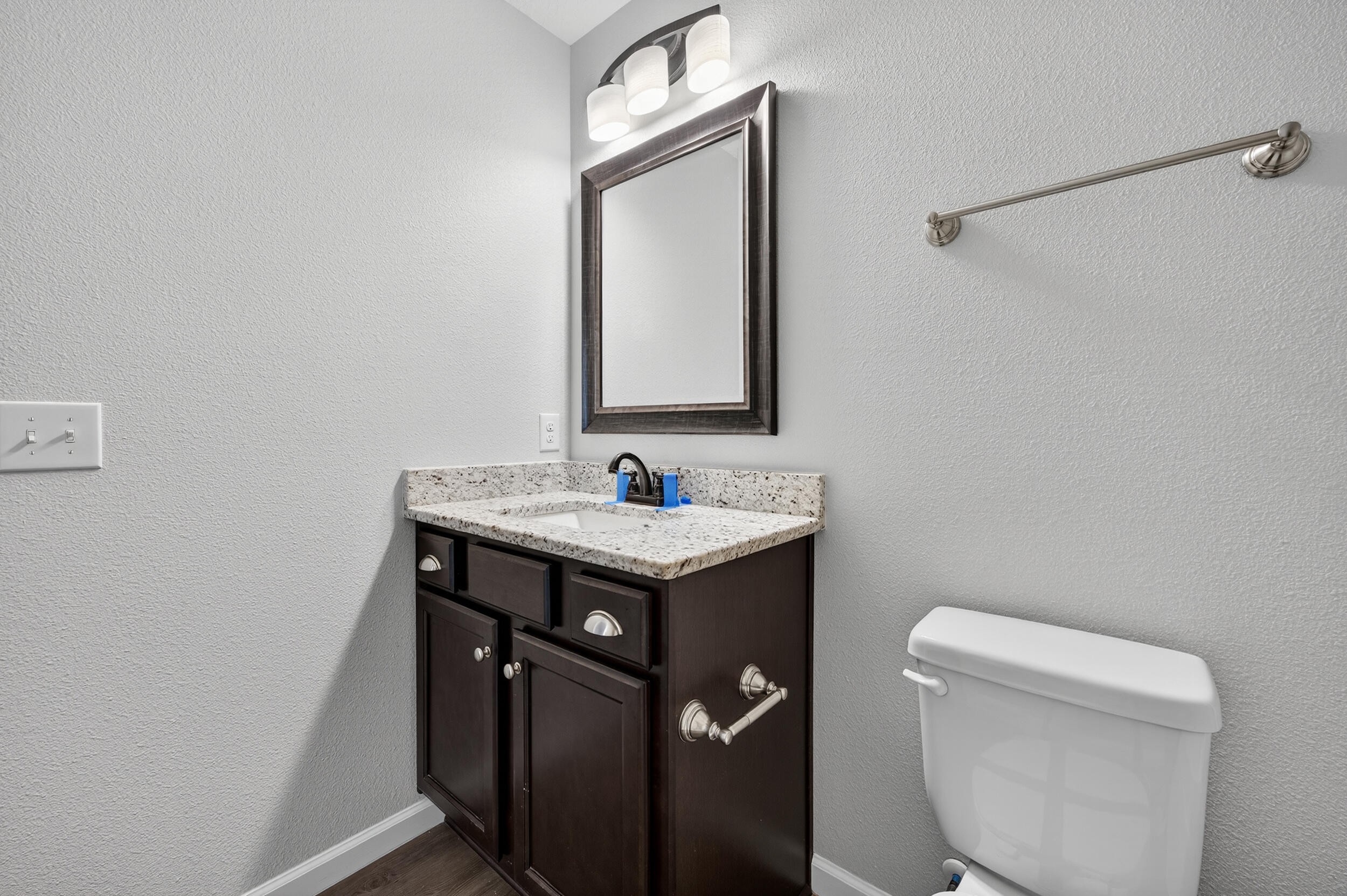 1833 Gainer Avenue Baker, FL 32531 - Photo 22 of 43 a bathroom with a sink a toilet and mirror