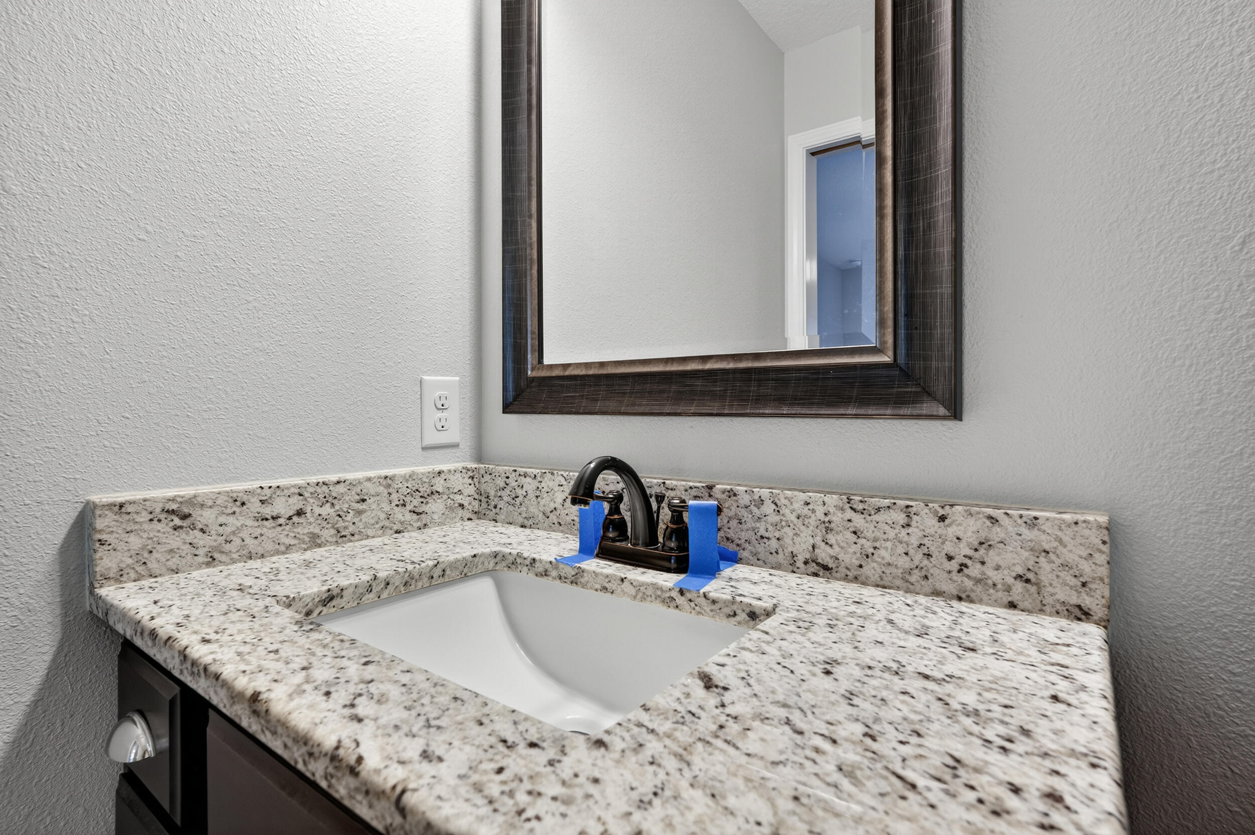 1833 Gainer Avenue Baker, FL 32531 - Photo 23 of 43 a bathroom with a granite countertop sink and a window
