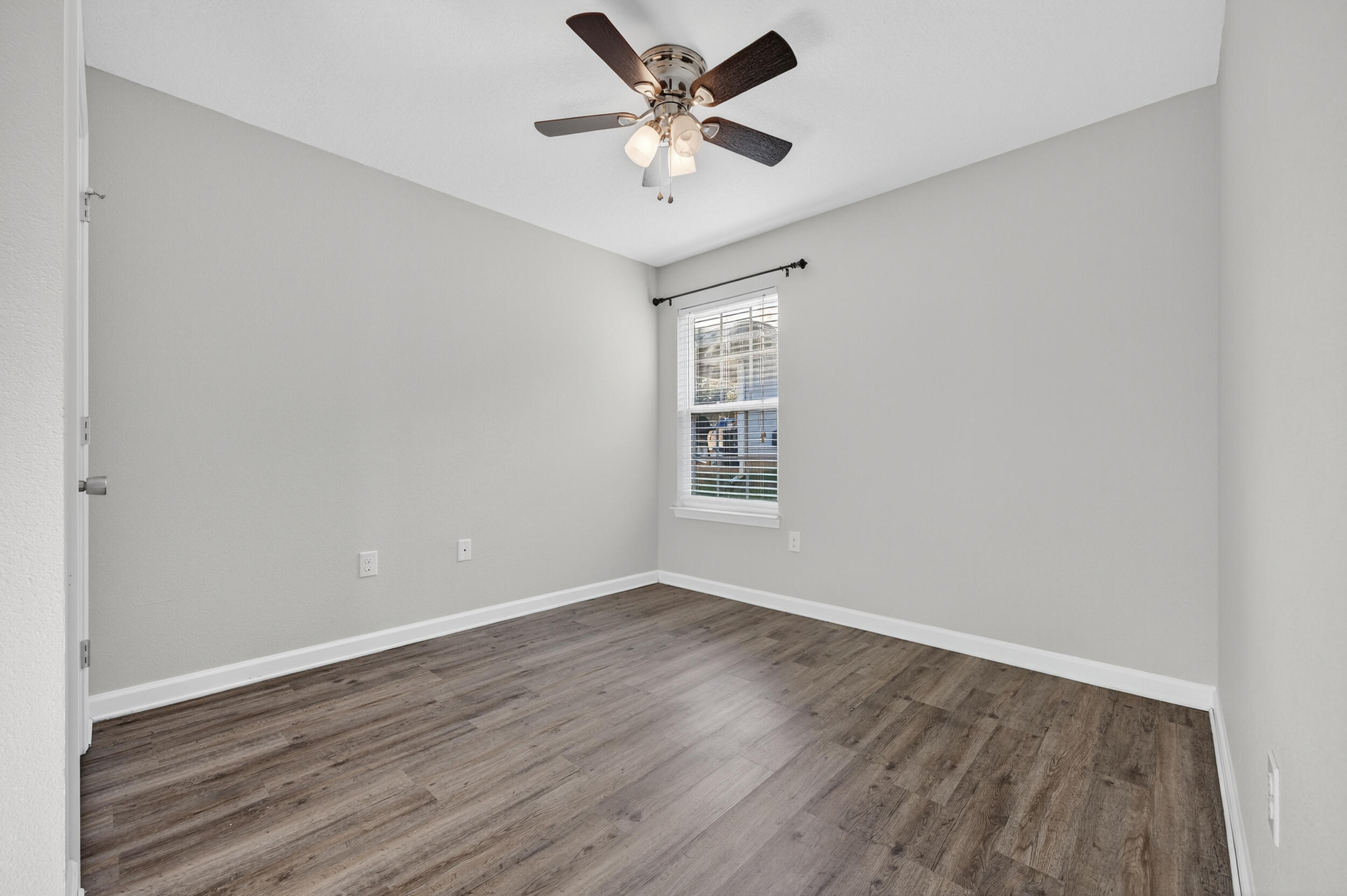 1833 Gainer Avenue Baker, FL 32531 - Photo 25 of 43 wooden floor in an empty room with a window