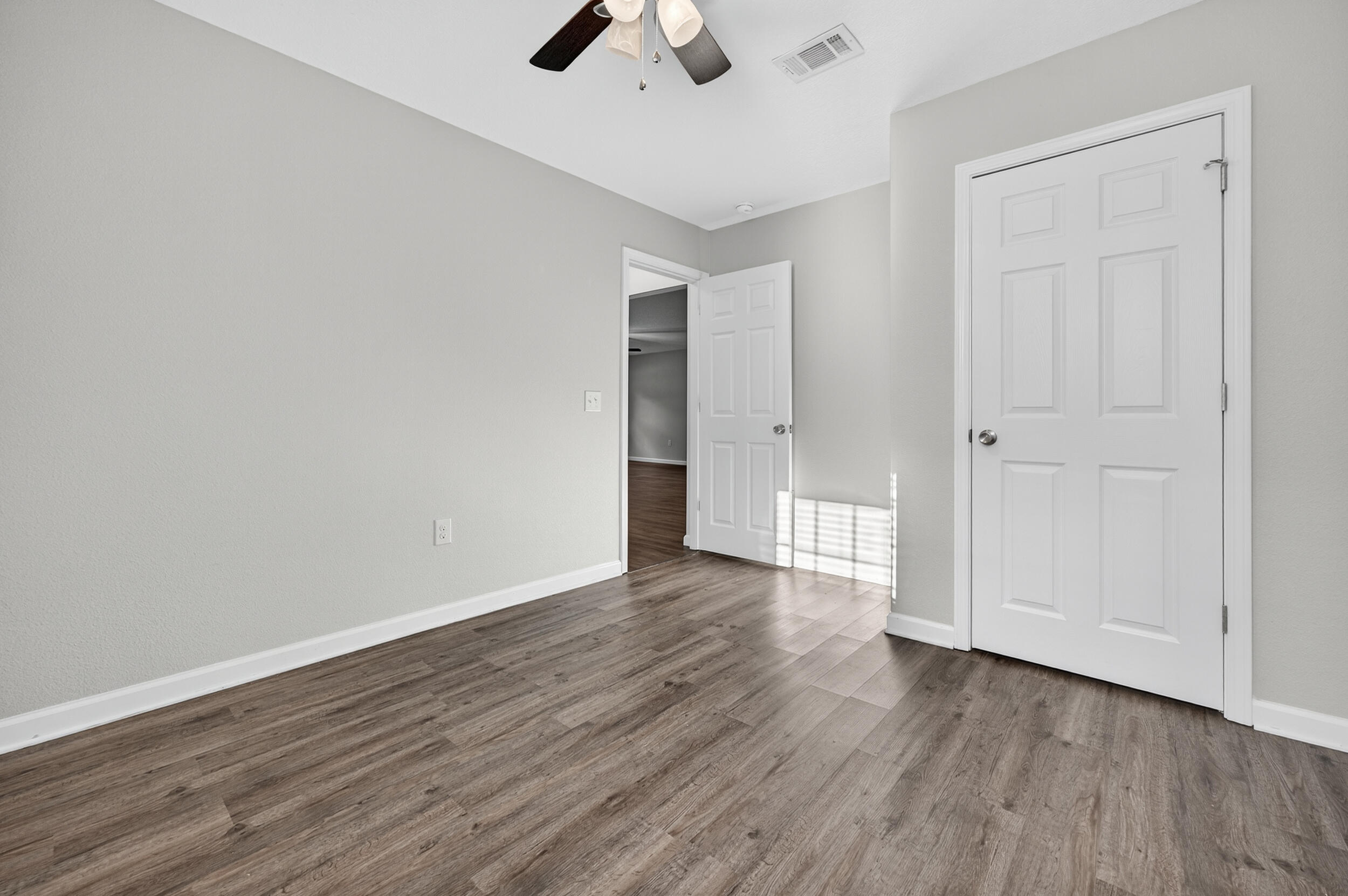 1833 Gainer Avenue Baker, FL 32531 - Photo 26 of 43 a view of an empty room with wooden floor