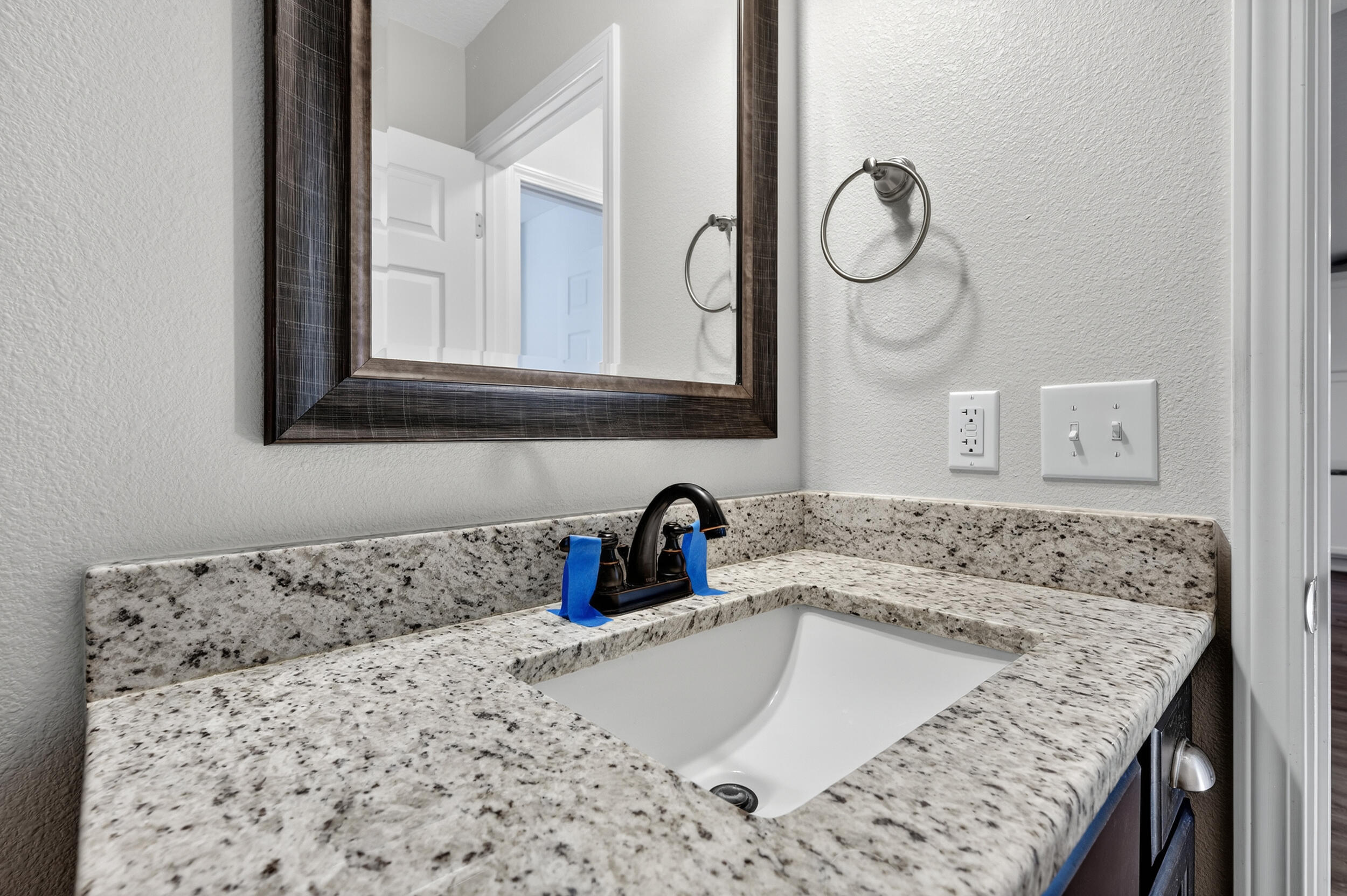 1833 Gainer Avenue Baker, FL 32531 - Photo 29 of 43 a bathroom with a granite countertop sink a mirror and shower