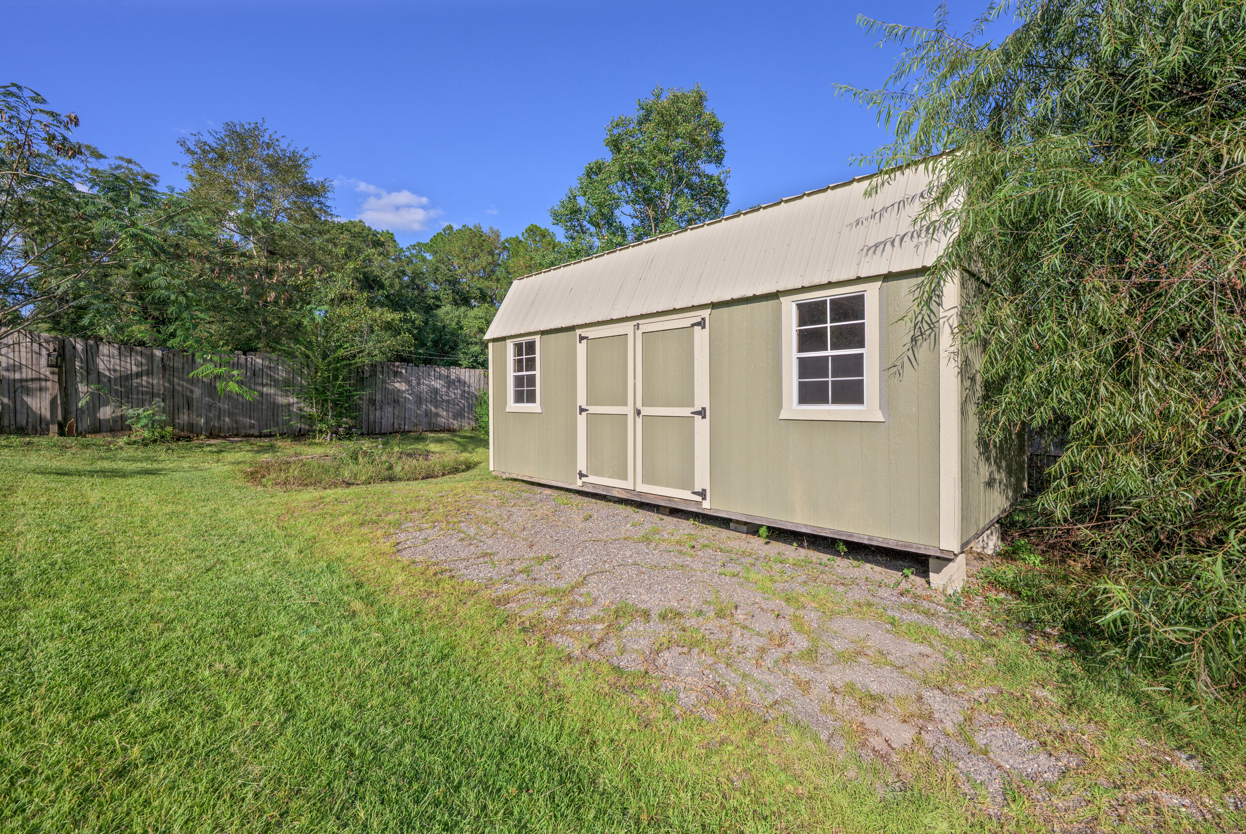 1833 Gainer Avenue Baker, FL 32531 - Photo 39 of 43 a view of a house with backyard and garden