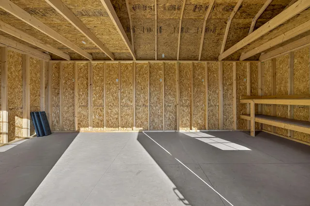 a view of a room with wooden walls