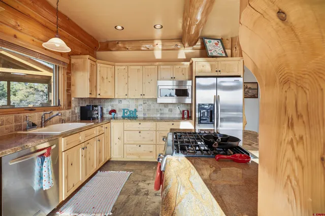 a stove top oven sitting inside of a kitchen