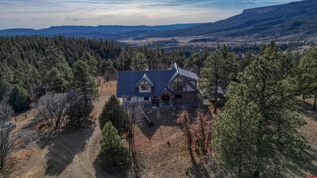 a view of a houses with a yard