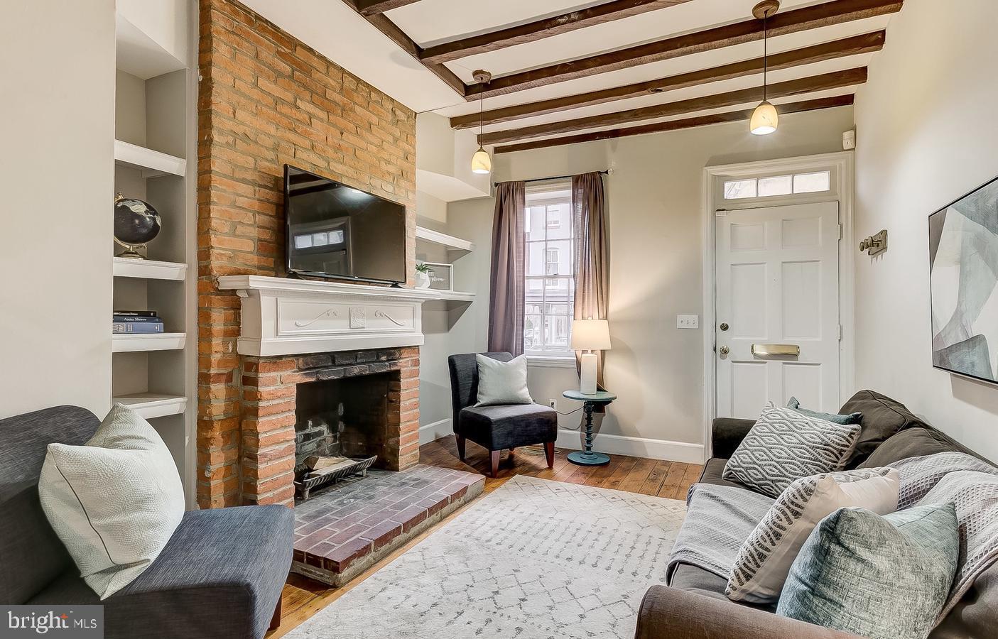 825 South Charles Street Baltimore, MD 21230 - Photo 11 of 34 a living room with furniture and a fireplace