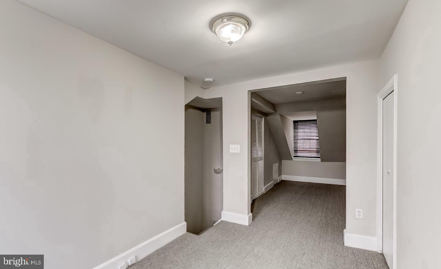 825 South Charles Street Baltimore, MD 21230 - Photo 18 of 34 an empty room with a hallway and a closet