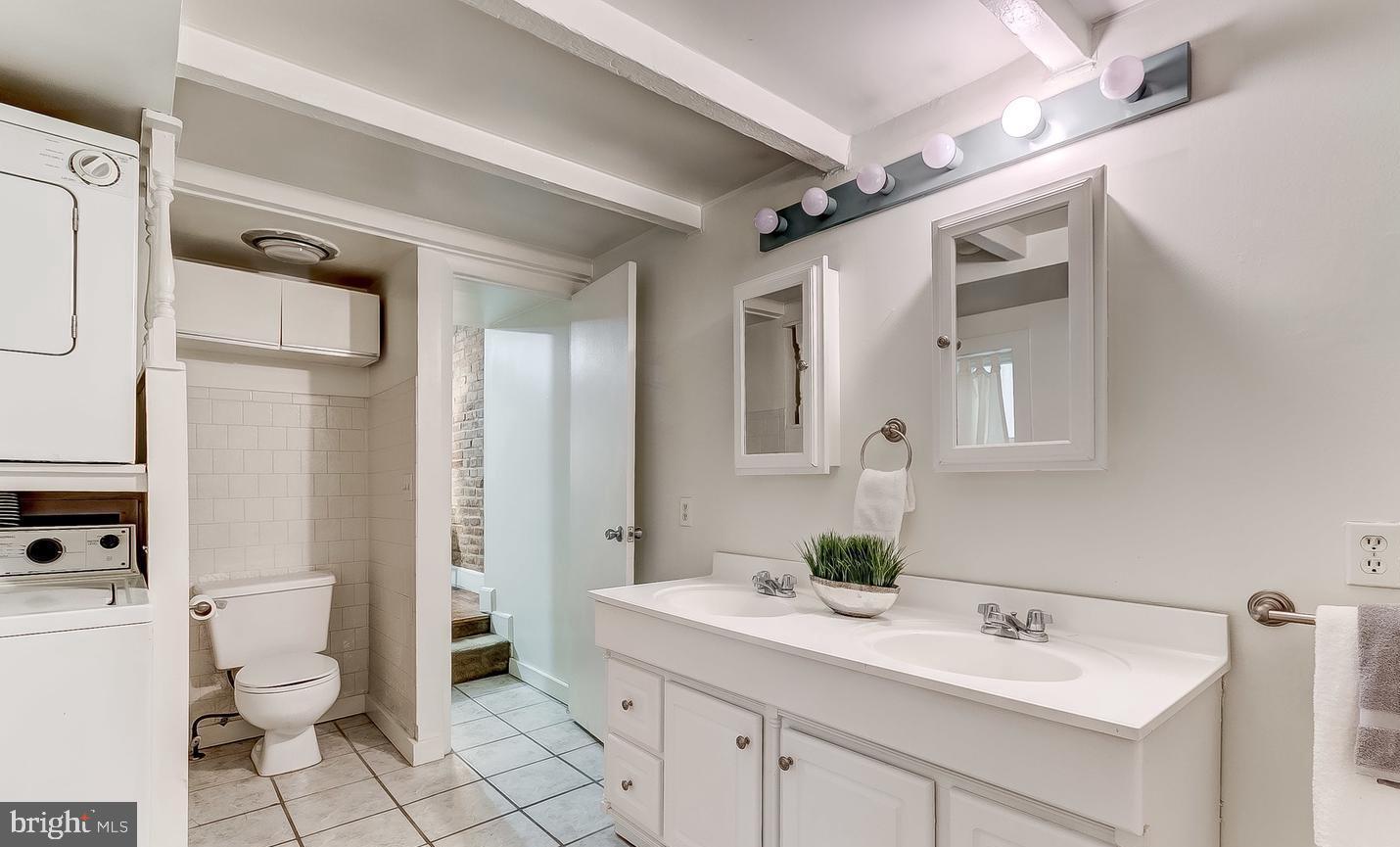 825 South Charles Street Baltimore, MD 21230 - Photo 21 of 34 a bathroom with a sink toilet and shower