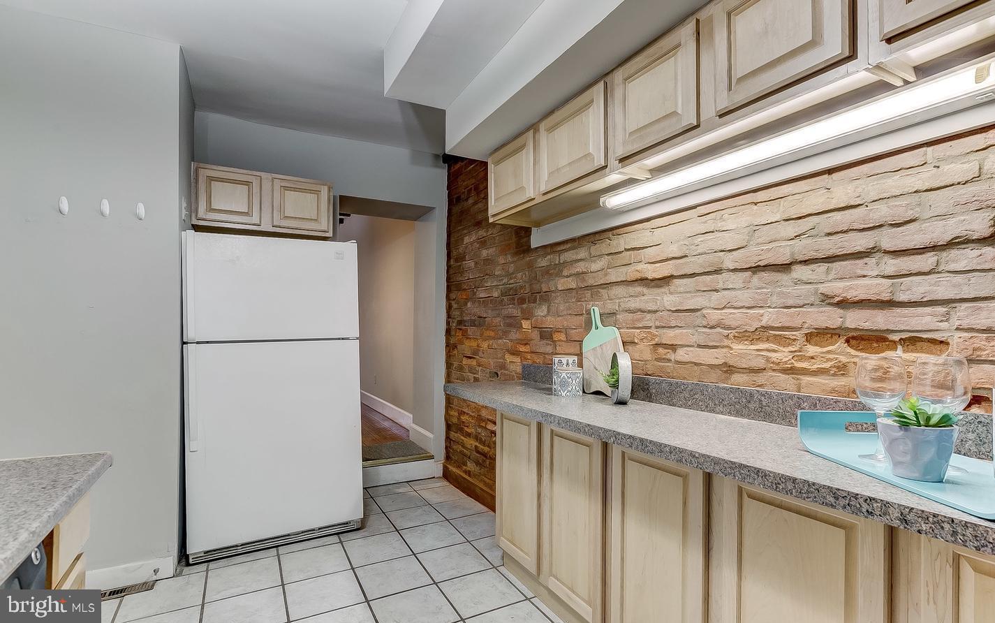 825 South Charles Street Baltimore, MD 21230 - Photo 3 of 34 a kitchen with stainless steel appliances a refrigerator and a counter