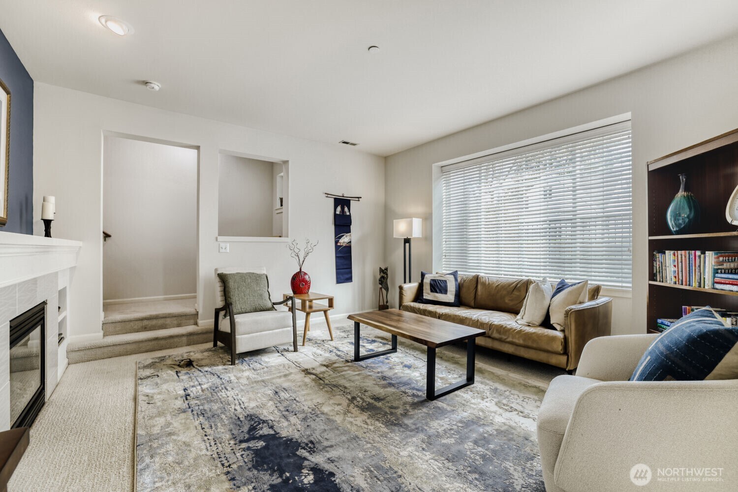 18705 101st Avenue Northeast, Unit 3 Bothell, WA 98011 - Photo 6 of 31 a living room with furniture and a fireplace