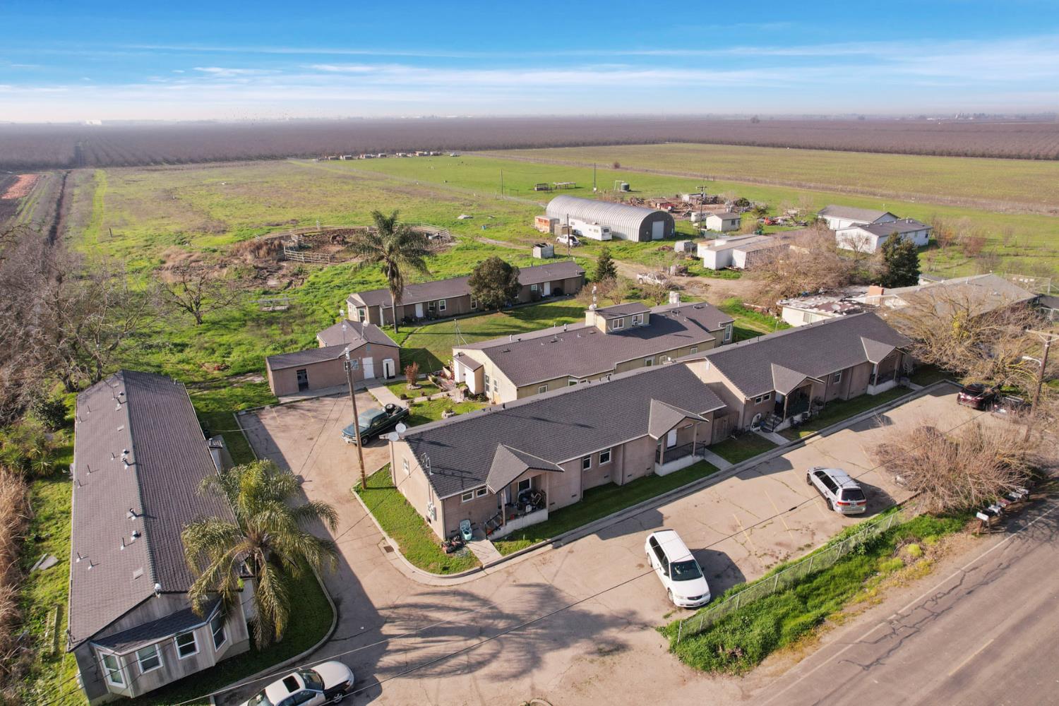 an aerial view of residential houses with outdoor space
