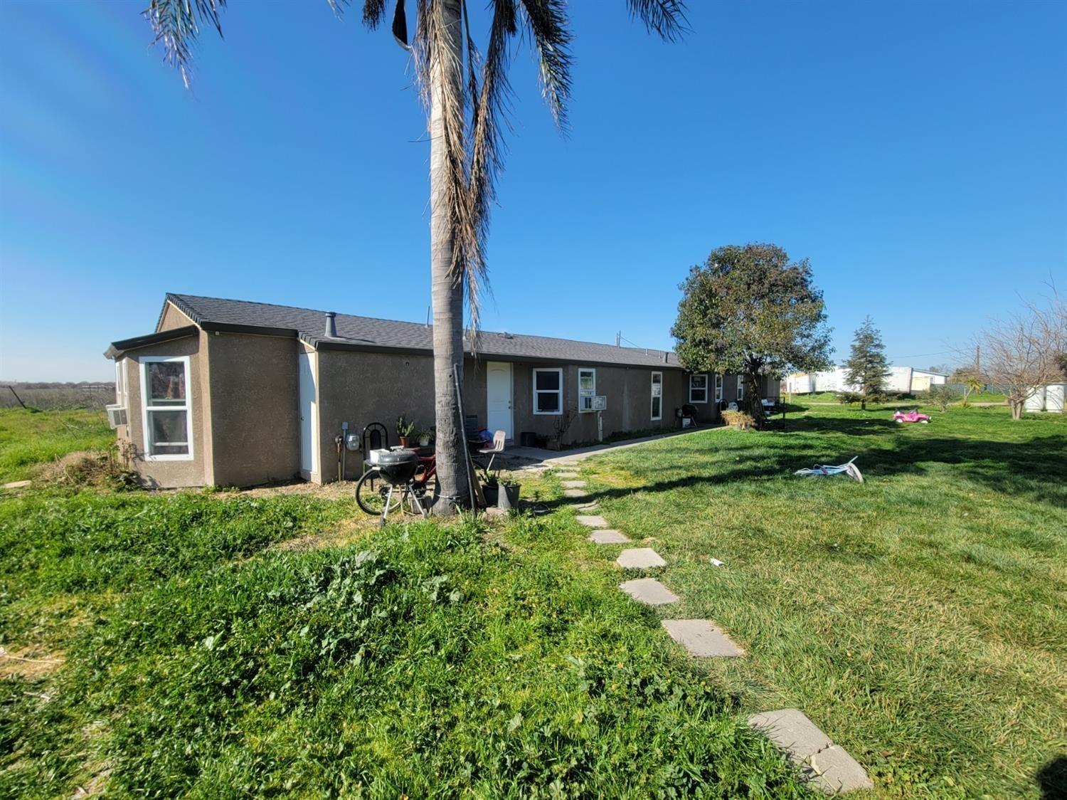 5125 South Kaiser Road Stockton, CA 95215 - Photo 4 of 23 a front view of a house with garden
