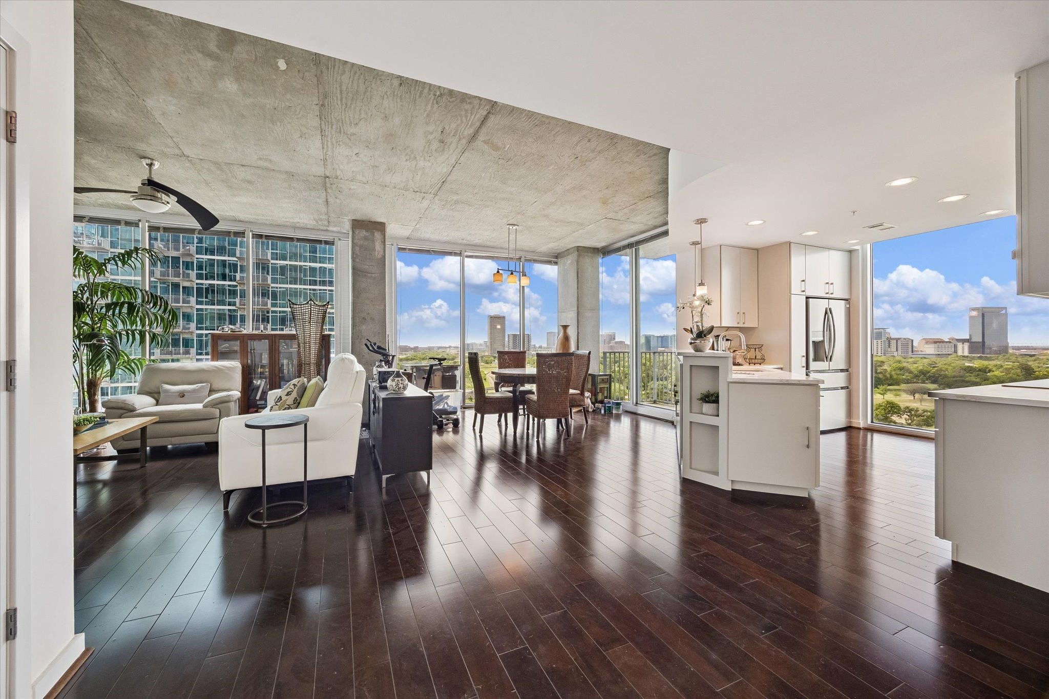 5925 Almeda Road, Unit 11218 Houston, TX 77004 - Photo 14 of 39 a living room with couches and kitchen view with wooden floor