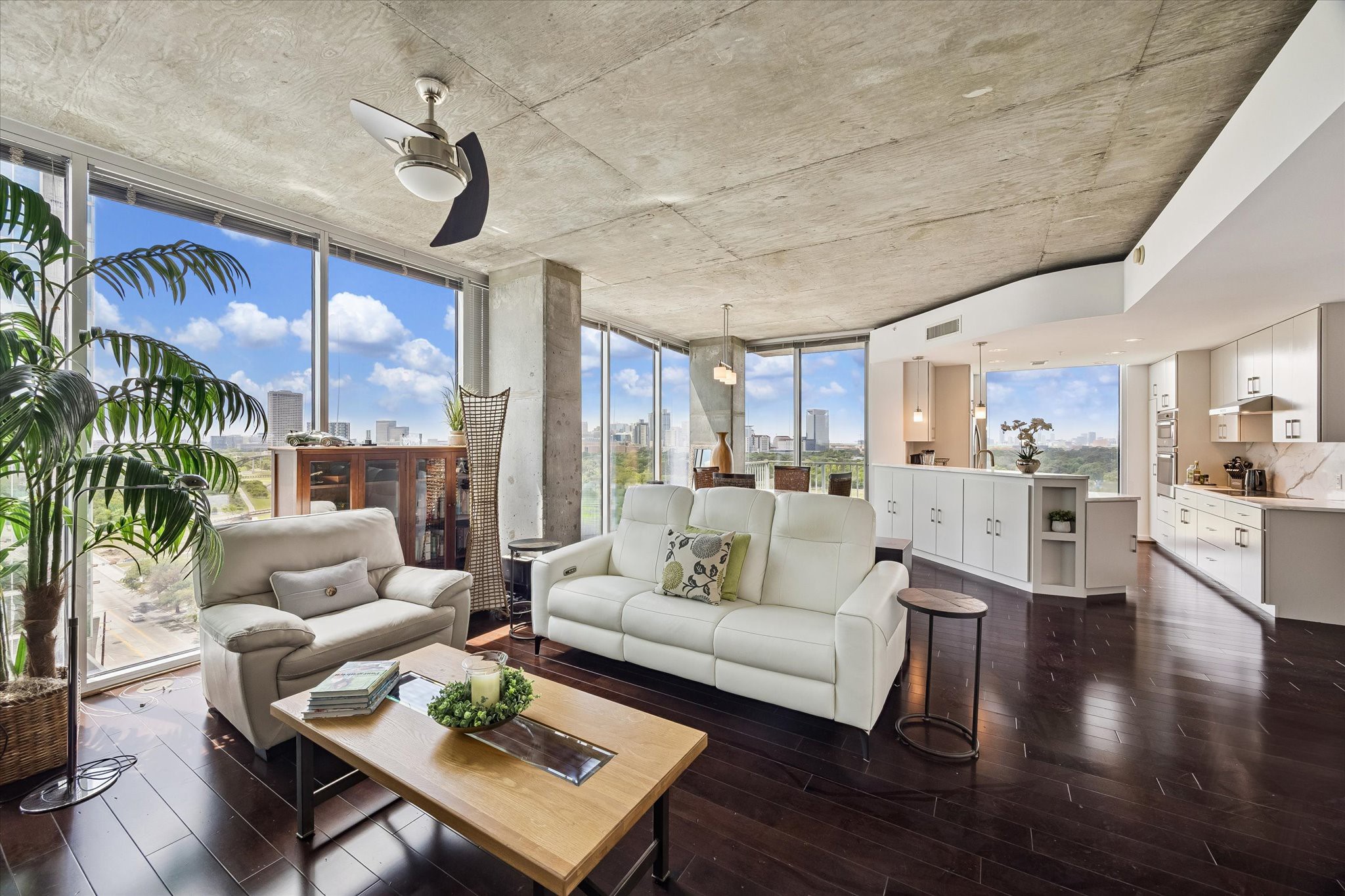 5925 Almeda Road, Unit 11218 Houston, TX 77004 - Photo 6 of 39 a living room with furniture kitchen view and a wooden floor