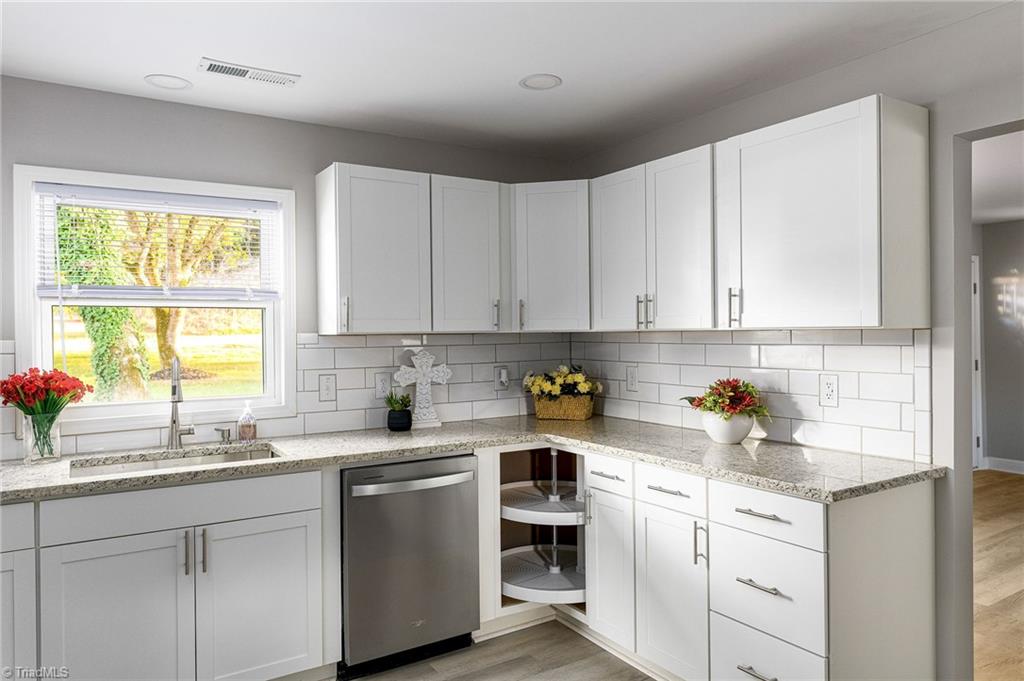 5515 Bethania Road Pfafftown, NC 27040 - Photo 15 of 49 All new windows and granite countertops with a lazy susan