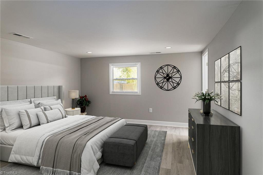 5515 Bethania Road Pfafftown, NC 27040 - Photo 21 of 49 Primary bedroom on main level with virtual staging to provide furnishing options