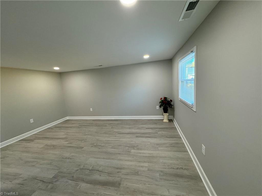 5515 Bethania Road Pfafftown, NC 27040 - Photo 22 of 49 All new recessed lighting, paint, flooring, windows, blinds, electrical and so much more!!