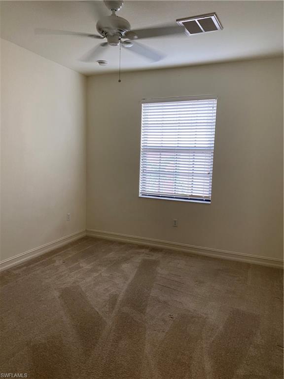 9151 Delano Street, Unit 9702 Naples, FL 34113 - Photo 11 of 14 an empty room with a window