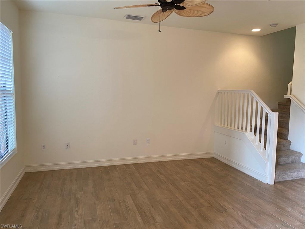 9151 Delano Street, Unit 9702 Naples, FL 34113 - Photo 6 of 14 a view of a room with wooden floor