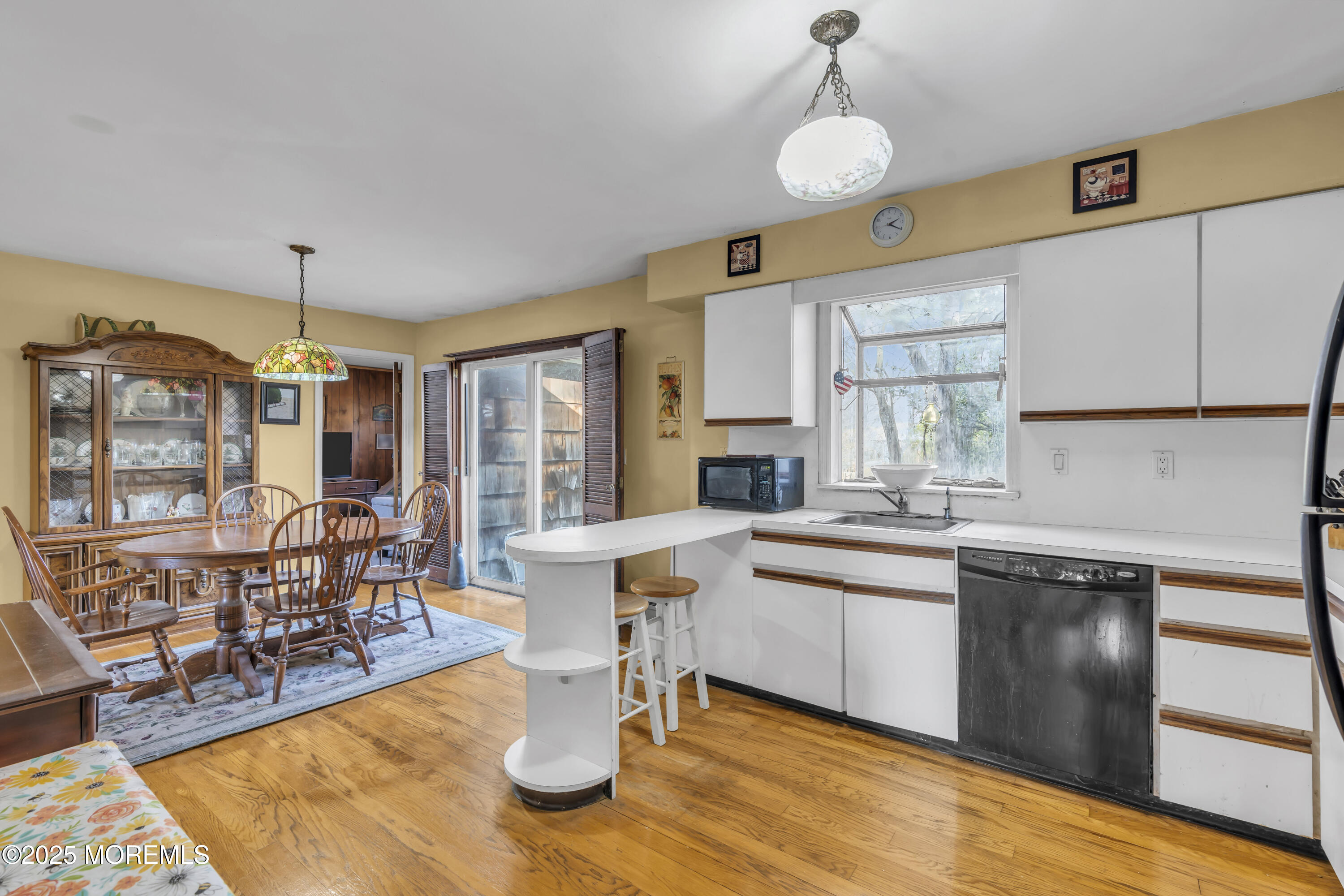 7 Whalepond Road Oakhurst, NJ 07755 - Photo 11 of 23 a kitchen with stainless steel appliances granite countertop a sink a stove and a wooden floors