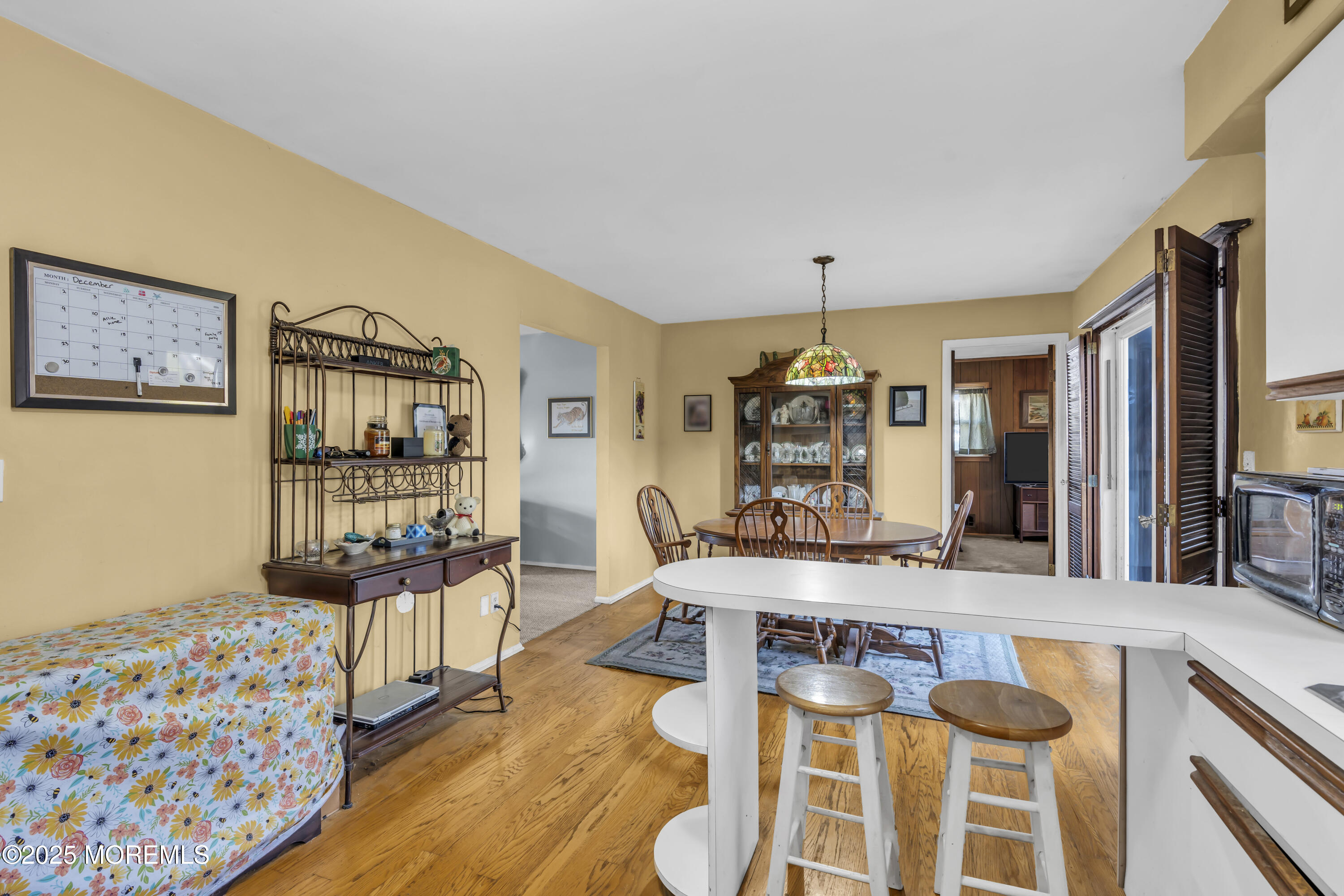 7 Whalepond Road Oakhurst, NJ 07755 - Photo 12 of 23 a living room with furniture and a flat screen tv