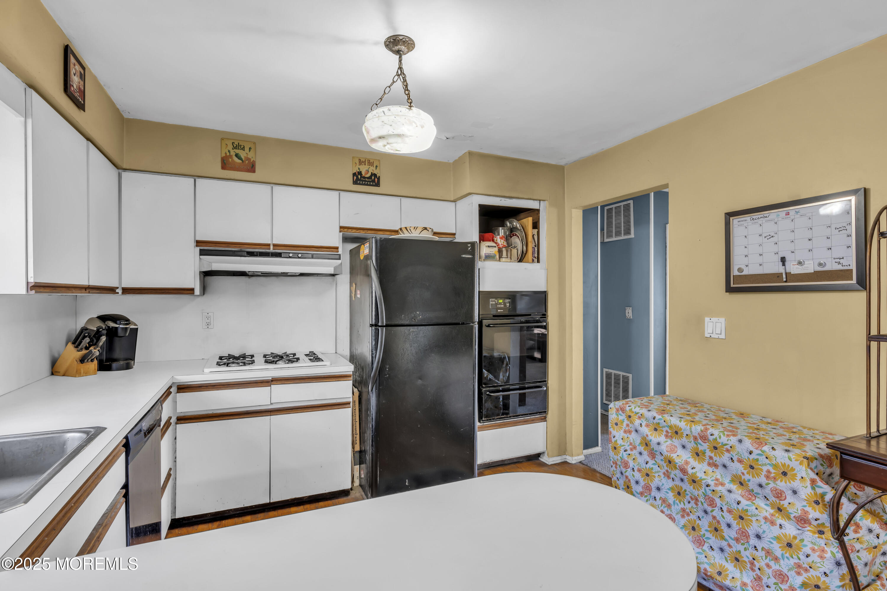 7 Whalepond Road Oakhurst, NJ 07755 - Photo 14 of 23 a kitchen with stainless steel appliances a refrigerator sink and cabinets