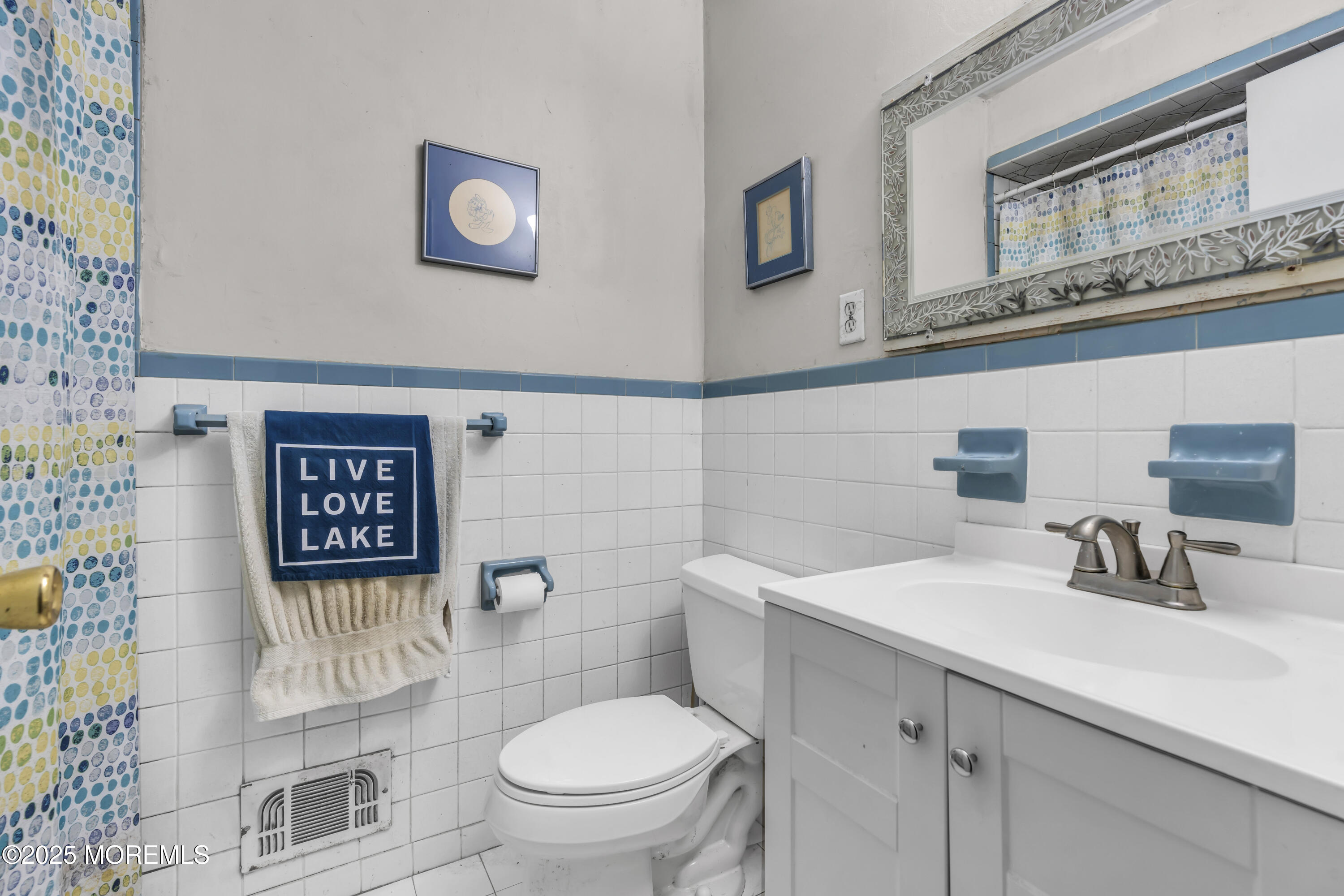 7 Whalepond Road Oakhurst, NJ 07755 - Photo 17 of 23 a bathroom with a toilet sink and mirror