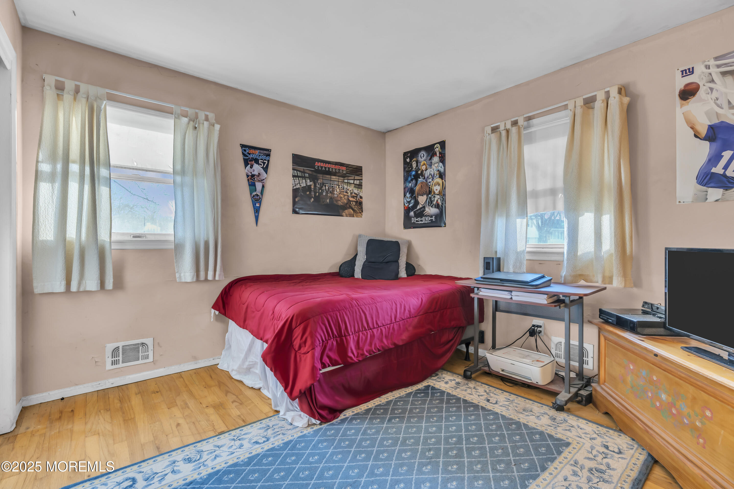 7 Whalepond Road Oakhurst, NJ 07755 - Photo 19 of 23 a bedroom with a bed and wooden floor