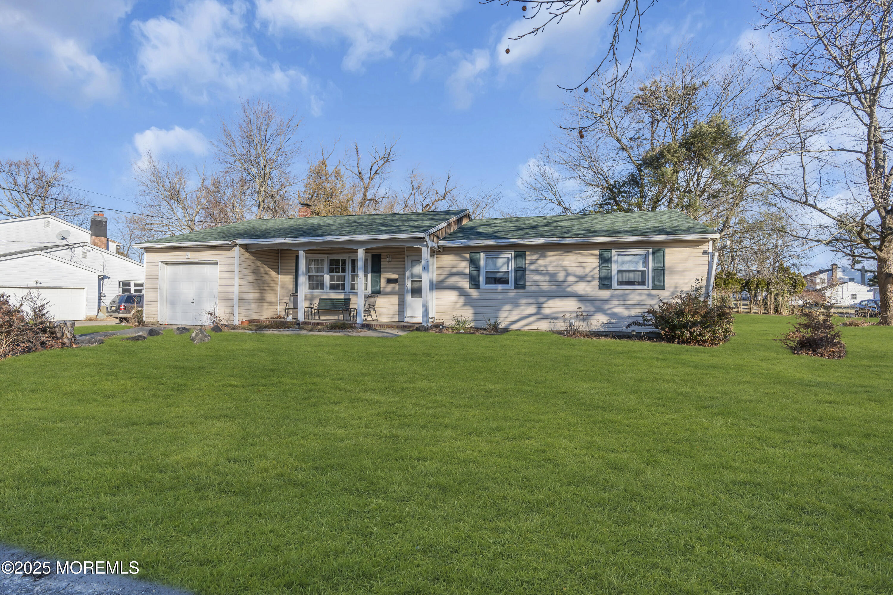 7 Whalepond Road Oakhurst, NJ 07755 - Photo 2 of 23 a front view of a house with garden