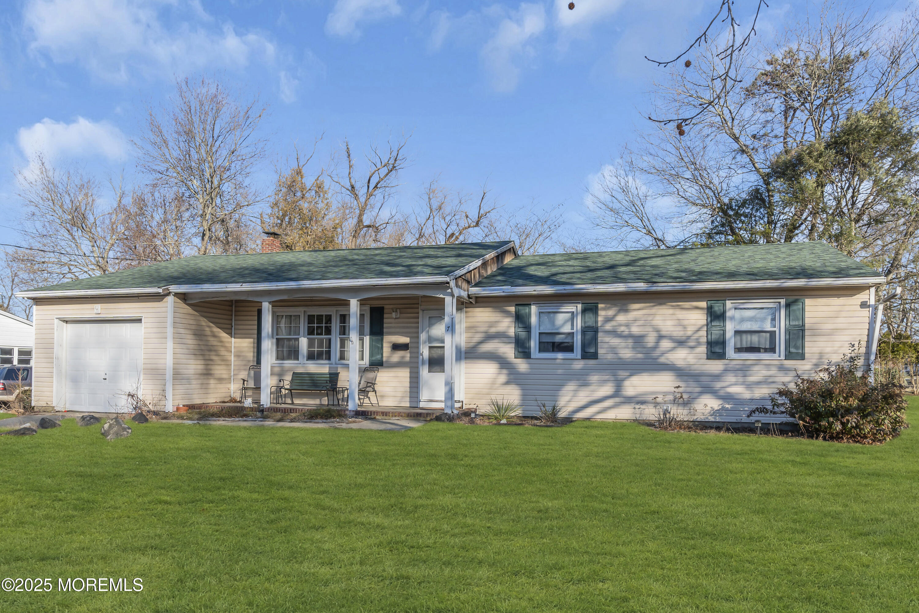 7 Whalepond Road Oakhurst, NJ 07755 - Photo 22 of 23 a front view of a house with garden