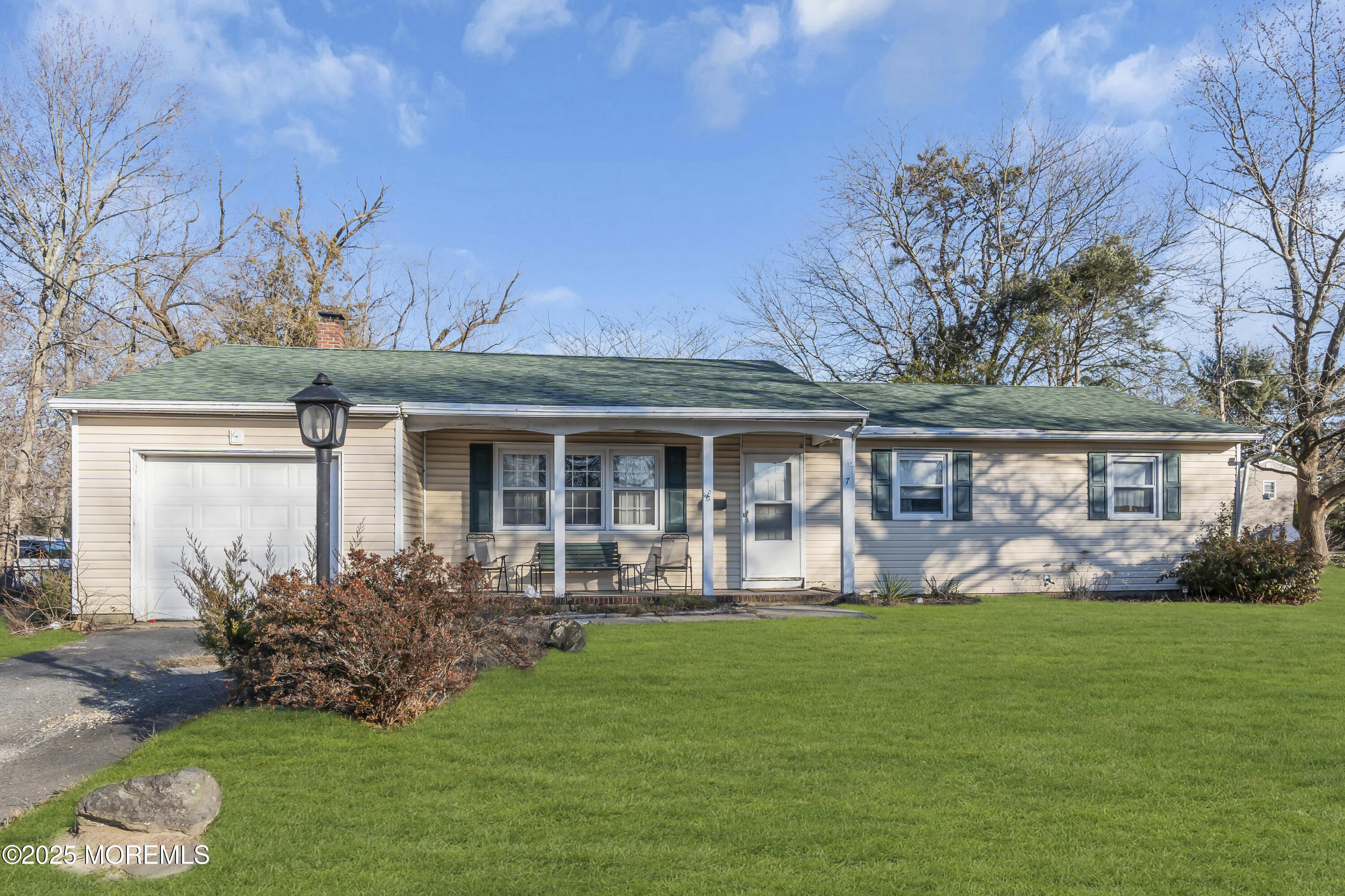 7 Whalepond Road Oakhurst, NJ 07755 - Photo 23 of 23 a front view of a house with garden and porch